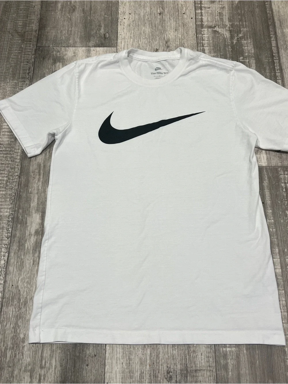 Nike White Short Sleeve T-Shirt with Black Swoosh Mens size Small